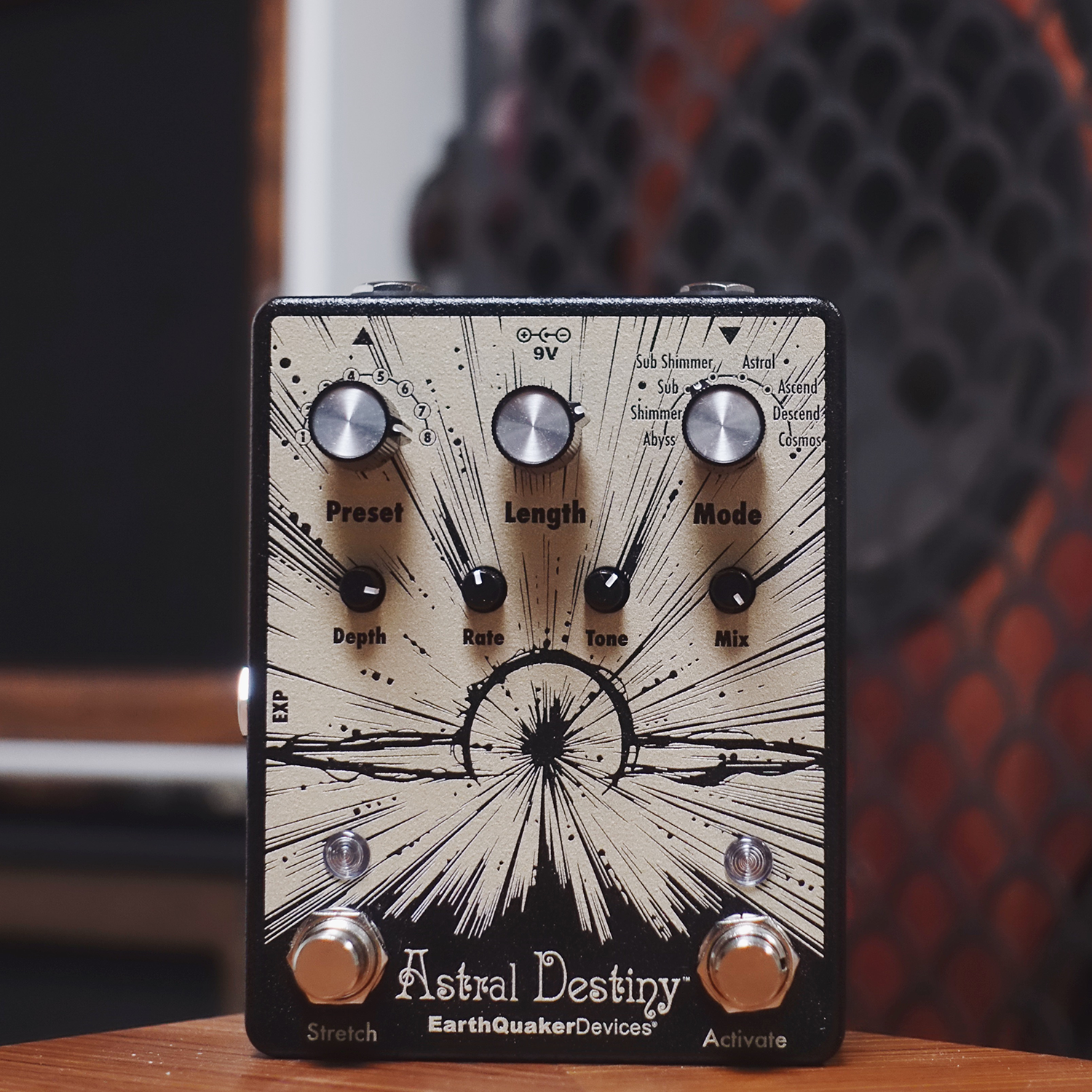 Guitar effects pedal with 'Astral Destiny' branding on a wooden surface.