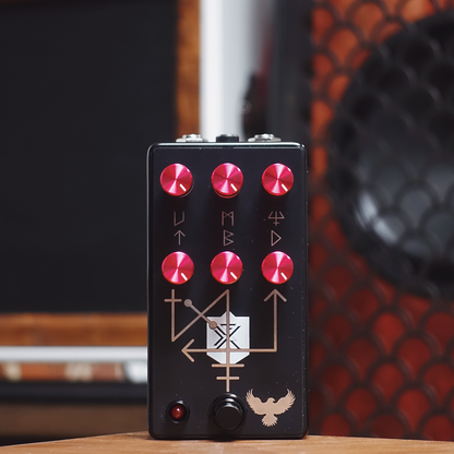 Balrog Guitar effects pedal with red knobs on a wooden surface at the Cult FX HQ