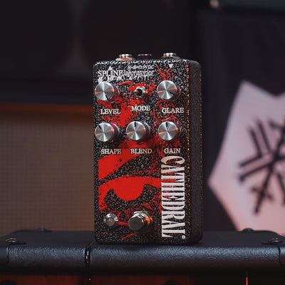 Cathedral fuzz and boost pedal Black and silver hammered enclosure with red art at  Cult FX headquarters