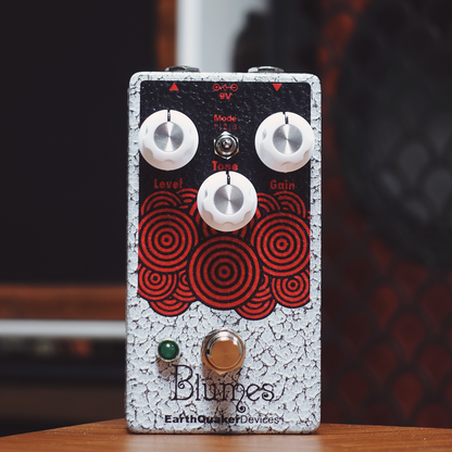 EarthQuaker Devices Guitar effects pedal with 'Blumes' branding on a wooden surface.