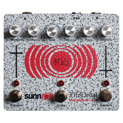 EarthQuaker Devices effects pedal with red circular design and visible branding on a white background